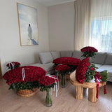 Living room with multiple arrangements of 1000 red roses